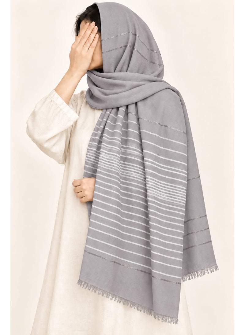 Light Grey Turkish lawn scarf with white stripes and fringed edges by Hijab ul Hareem, worn as a hijab