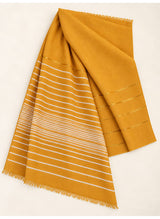 Mustard Turkish lawn scarf with white stripes and fringed edges by Hijab ul Hareem, flat-lay showing fabric and stripe details