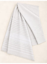 White Turkish lawn scarf with subtle grey stripes and fringed edges by Hijab ul Hareem, flat-lay showing fabric and stripe details