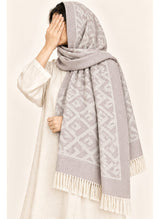 Taupe geometric wool winter scarf, 31 × 72 inches, worn as a hijab on a model — Hijab Ul Hareem